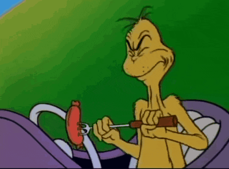 a cartoon character is standing next to a white hand .