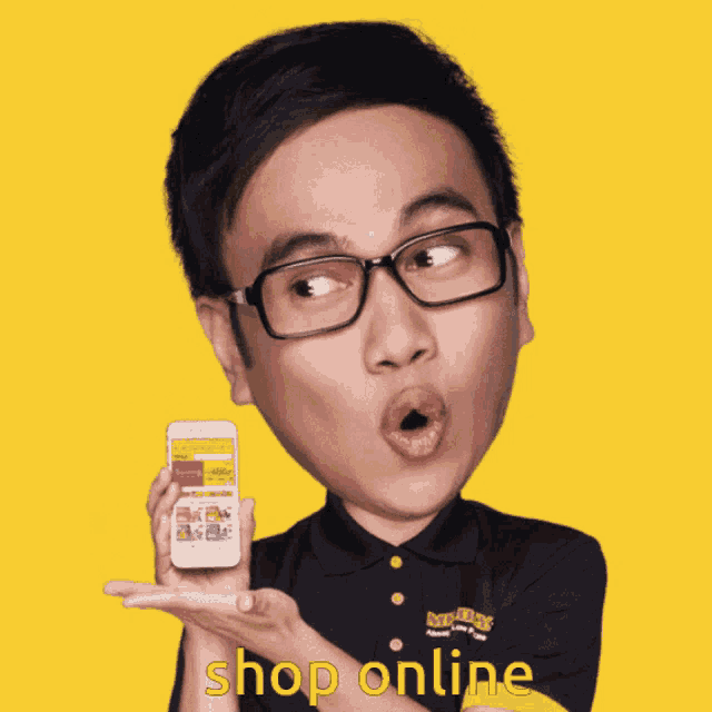 a man wearing glasses holds a cell phone in his hand with the words shop online above him