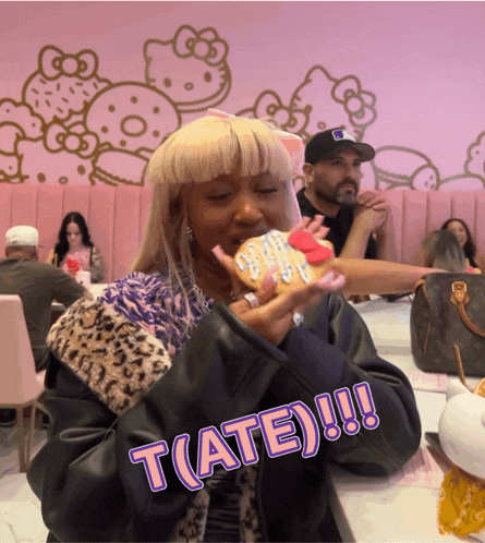 a woman eating a cookie with the word t ( ate ) written on the bottom