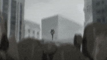 a black and white drawing of a man flying through the air in front of a building .