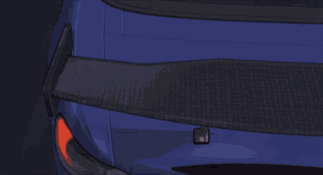 a blue car with a spoiler that says ' rs ' on it