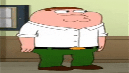 peter griffin from family guy is standing in a room .