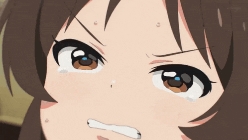 a close up of a girl 's face with her eyes closed