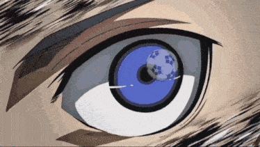 a close up of a person 's eye with a blue soccer ball in it