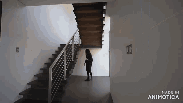 a woman is standing on a set of stairs made by animatica