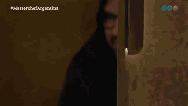 a man with glasses and a beard is on a masterchef argentina channel