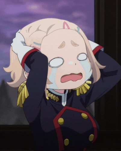 a girl in a black and red uniform is crying