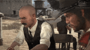 a man in a cowboy hat is talking to another man