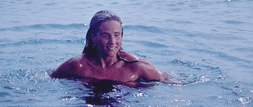 a person is swimming in a pool of water