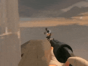 a person is holding a gun in front of a man in a video game .