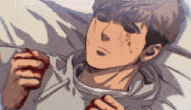 a man with blood on his face is laying in bed .