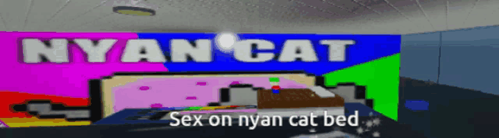 a colorful wall with the words nyan cat on it