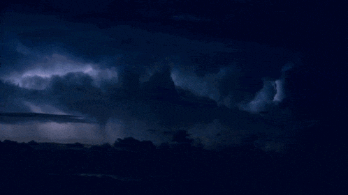 a dark cloudy sky with a lightning strike