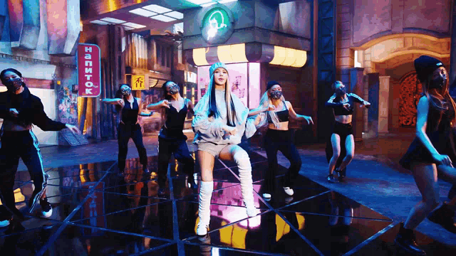 a group of dancers are dancing in front of a sign that says напиток