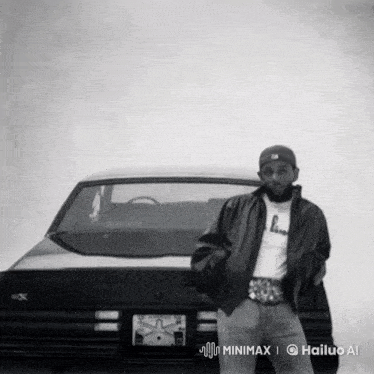 a black and white photo of a man standing next to a car
