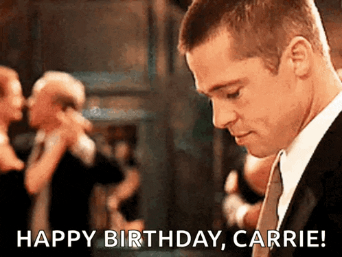 a man in a suit says happy birthday carrie