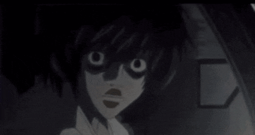 a close up of a person 's face with a surprised look on it .