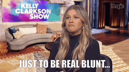 kelly clarkson says just to be real blunt in front of a couch