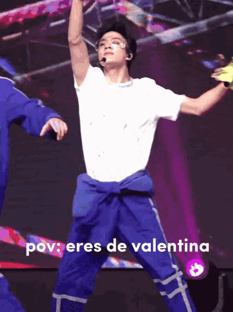 a man in a white shirt and blue pants is jumping in the air with the words " pov eres de valentina " below him