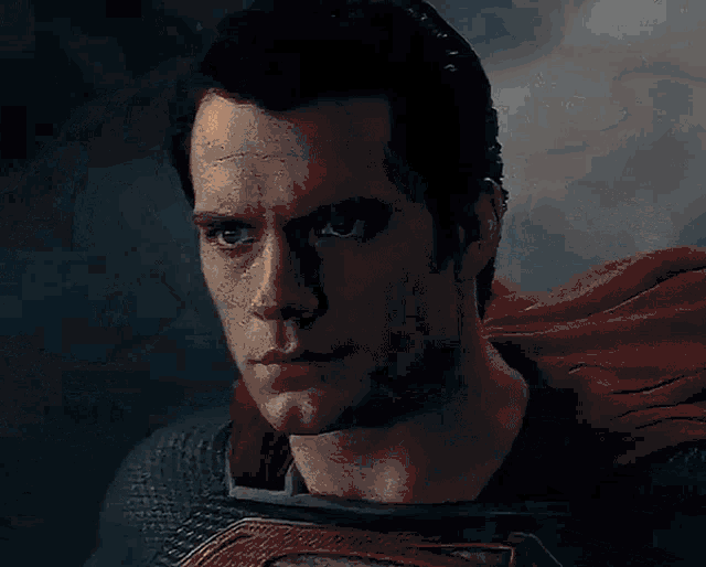 a blurry picture of a man in a superman suit .