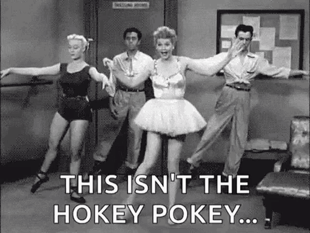 a black and white photo of a group of people dancing .