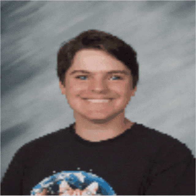a man wearing a black shirt with a picture of earth on it