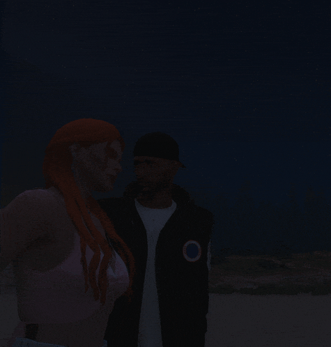 a man and woman are standing next to each other in the dark
