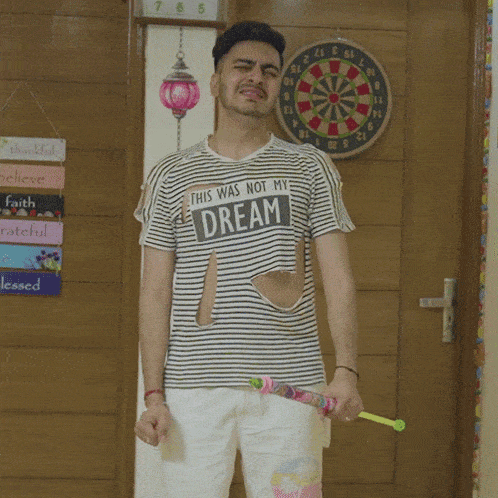 a man in a striped shirt that says this was not my dream