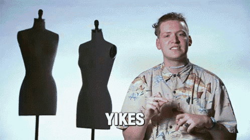 a man in a hawaiian shirt says yikes in front of two mannequins