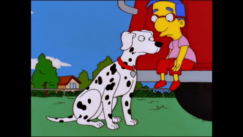 a dalmatian dog sitting next to a boy in a cartoon