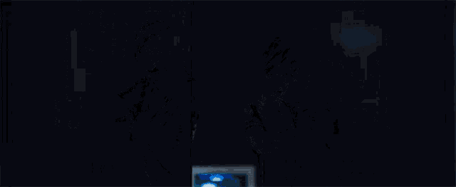 a man and woman are holding guns in a dark room