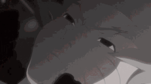 a close up of a person 's face with their eyes closed .
