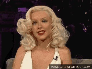 a gif of a woman with blonde hair and red lips says make gifs at gifsoup.com on the bottom