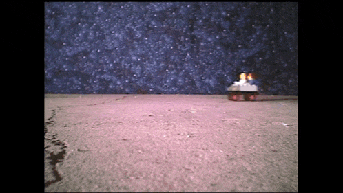 a model of a space ship is sitting on the ground