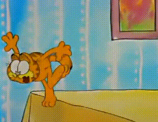 a cartoon of garfield is standing on a table