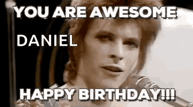 a black and white photo of david bowie singing into a microphone and saying `` you are awesome daniel happy birthday !!! ''