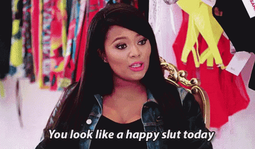 a woman is sitting in a chair and saying you look like a happy slut today .