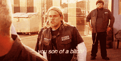 a man in a leather vest with the word son on it
