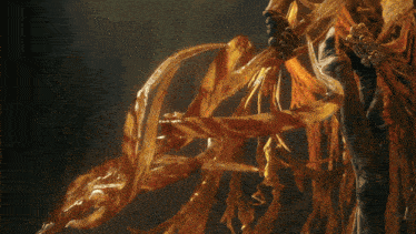 a statue of a person with a sword and a swirling cloth around them