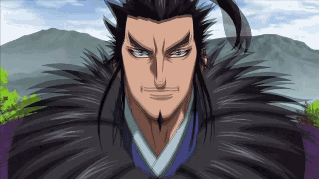 a man with long black hair and a beard