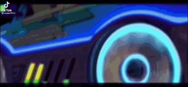a blurred image of a car with a circle in the middle of it .