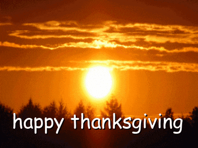 a picture of a sunset with the words happy thanksgiving written below it