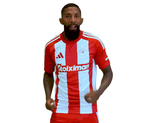 a man wearing a red and white striped shirt with the word stoixima on it