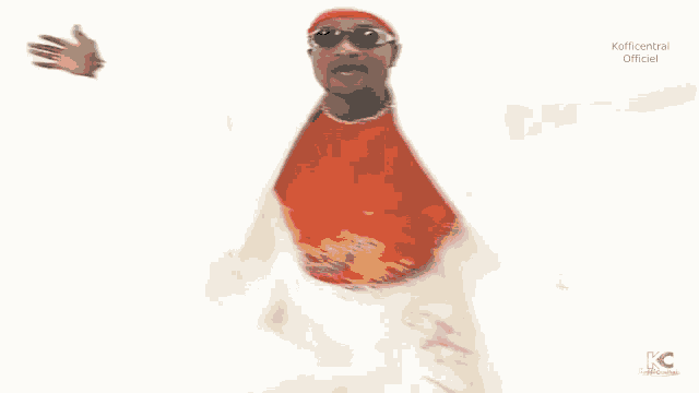 a man in a white suit and red tie is dancing with his arms outstretched