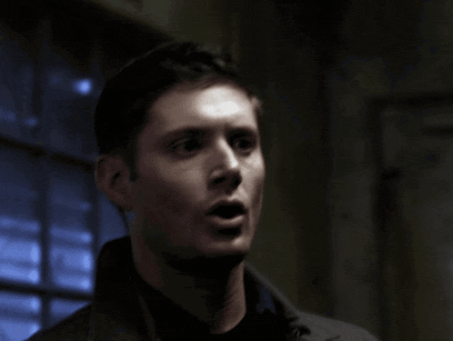 a man is making a surprised face with his mouth open