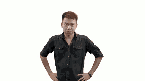 a man in a black shirt is making a funny face