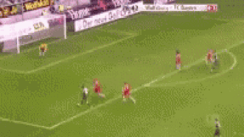 a soccer game is being played on a field with a banner that says der neuen gel gti .