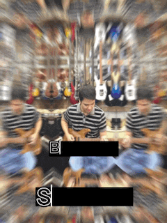 a blurry picture of a man playing a guitar with the letter s in the corner