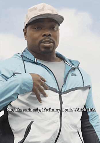a man wearing a nike jacket says " no like seriously i 's funny look watch this "