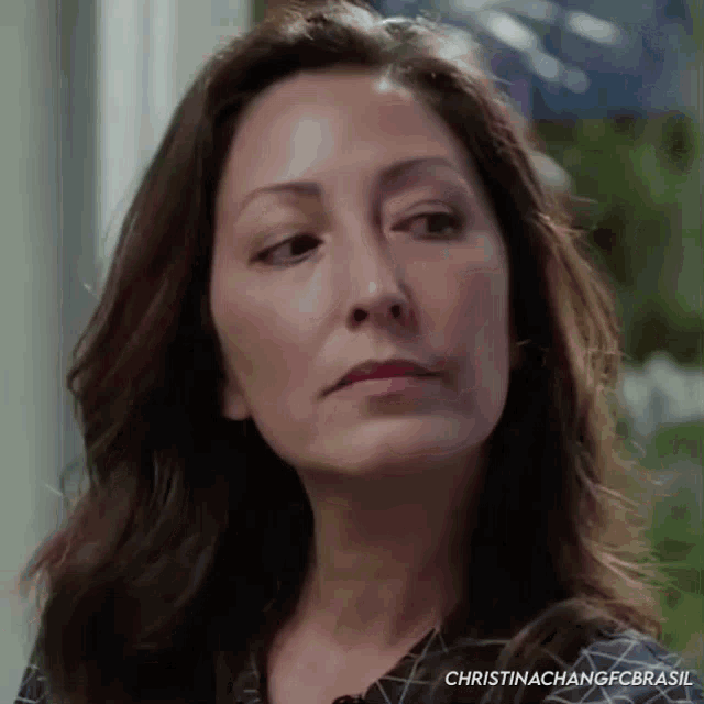 a close up of a woman 's face with the name christina chang fc brasil written on the bottom